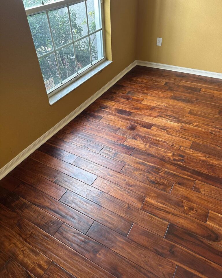 Hand-scraped hardwood flooring in a cozy sunlit room — transform your space with a Free Flooring Quote.