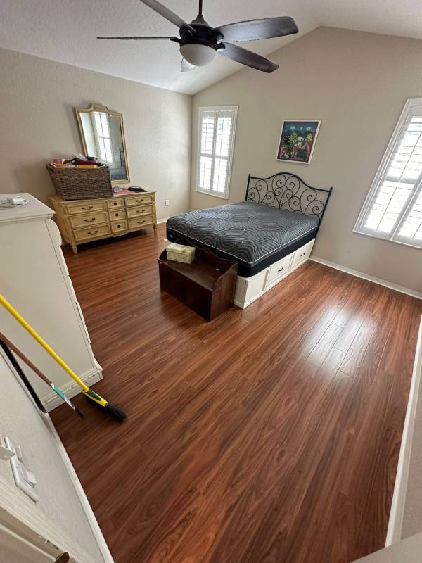 Wood-look laminate flooring installed in a bright living space