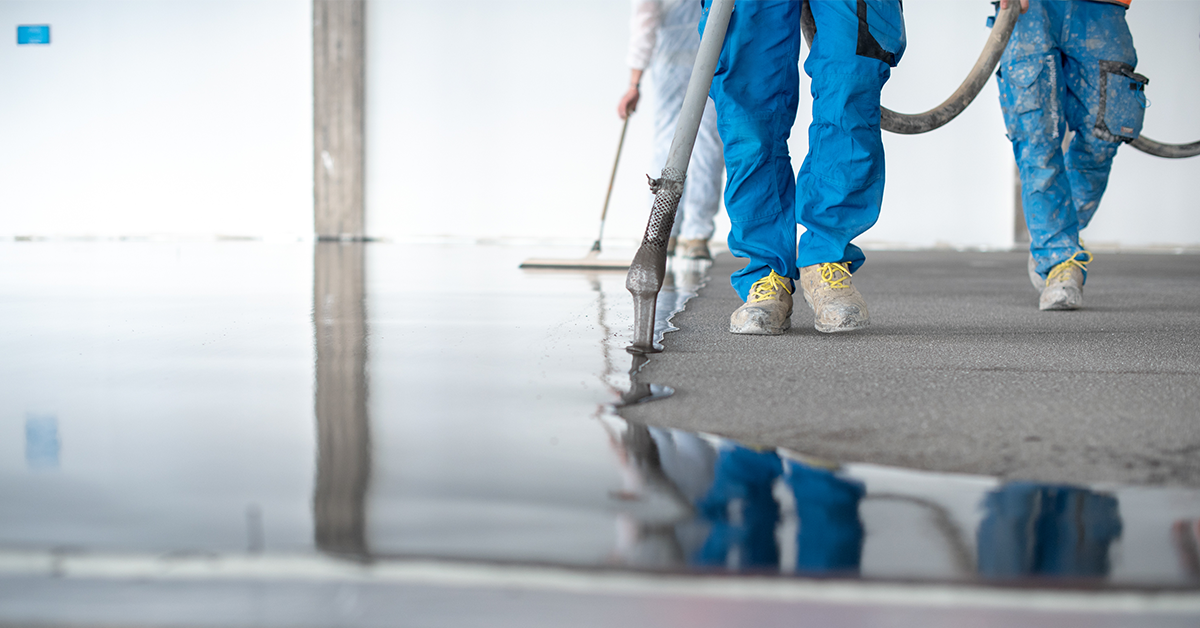 A glossy dark gray floor showcasing a finished garage floor epoxy installation.