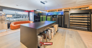 The interior of the Red Eagle Flooring showroom, highlighting the organized space and wide variety of materials available. The image shows diverse flooring options, from wood to tile, demonstrating the company's role as a complete flooring supplier.