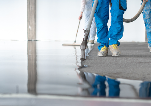 A glossy dark gray floor showcasing a finished garage floor epoxy installation.