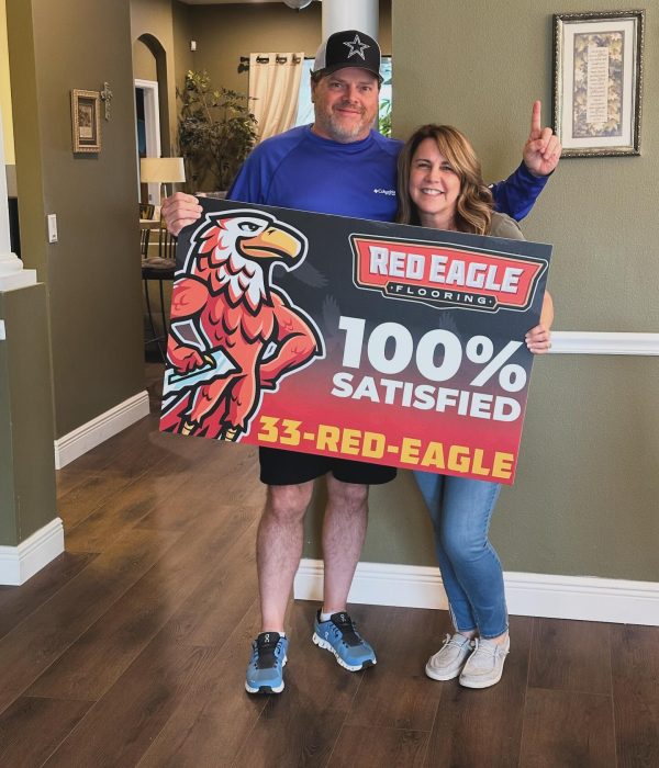 couple with 100% satisfied sign