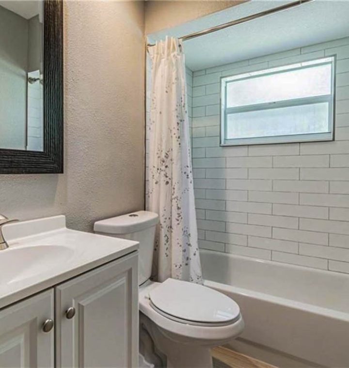 Bathroom Remodel, toilet, shower and tub are, backsplash, vanity area, mirror, and flooring