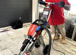Floor removal in progress using professional equipment — Red Eagle Flooring offers clean demolition services with a Free Flooring Quote.